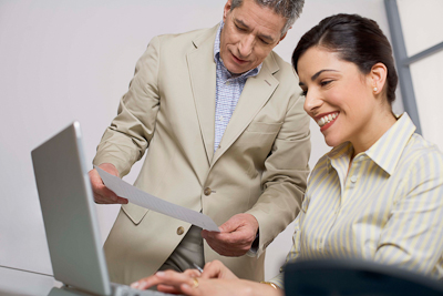 Woman Typing More Employers Look to Temp Services in Recession
