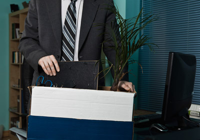 Man Cleaning Out Desk Man Cleaning Out Desk