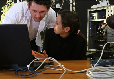 Man and Woman Working With Computer