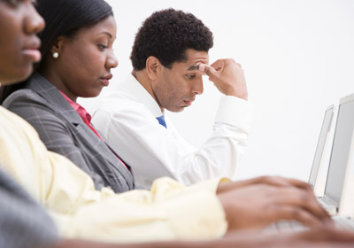 Overworked Man at Computer Overworked Man at Computer