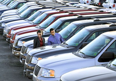 Couple Looking at Used Cars