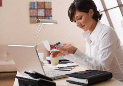 Woman With Computer and Credit Card
