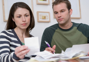Couple Reviewing Receipts Couple Reviewing Receipts