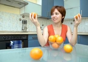 Woman Opening an Orange Woman Opening an Orange