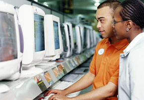 Employee and Women Looking at Computer Employee and Women Looking at Computer