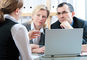 Woman Explaining Matters to Couple Woman Explaining Matters to Couple