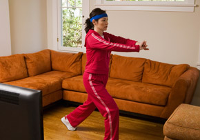 Woman Exercising in Her Living Room Woman Exercising in Her Living Room