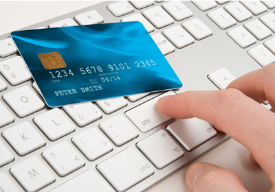 Hand on Laptop with Credit Card