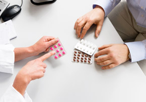 Doctor Explaining Medication Options Doctor Explaining Medication Options