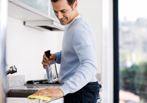 Man Cleaning Kitchen
