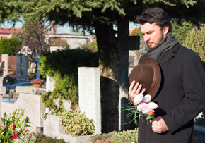 Man Visiting a Cemetery Man Visiting a Cemetery