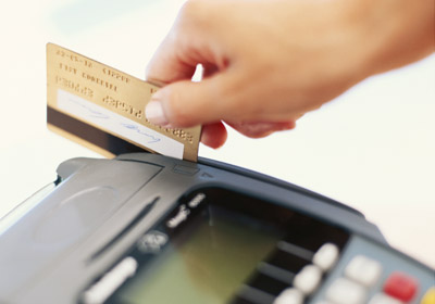 Hand Swiping Credit Card