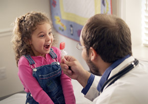 Doctor Giving Excited Girl Candy Doctor Giving Excited Girl Candy