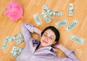 Woman Resting With Money and Piggy Bank