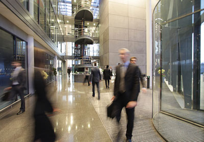 Businessman in Busy Lobby