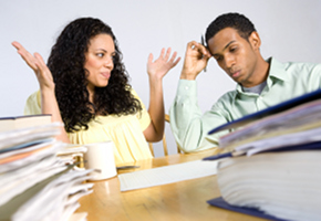 Man and Woman Filing Paperwork Man and Woman Filing Paperwork