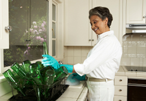 Woman Washing Bottles for Recycling Woman Washing Bottles for Recycling
