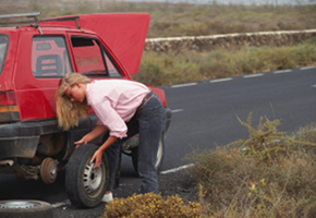 Woman Changing Tire Woman Changing Tire