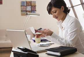 Woman With Computer and Debit Card